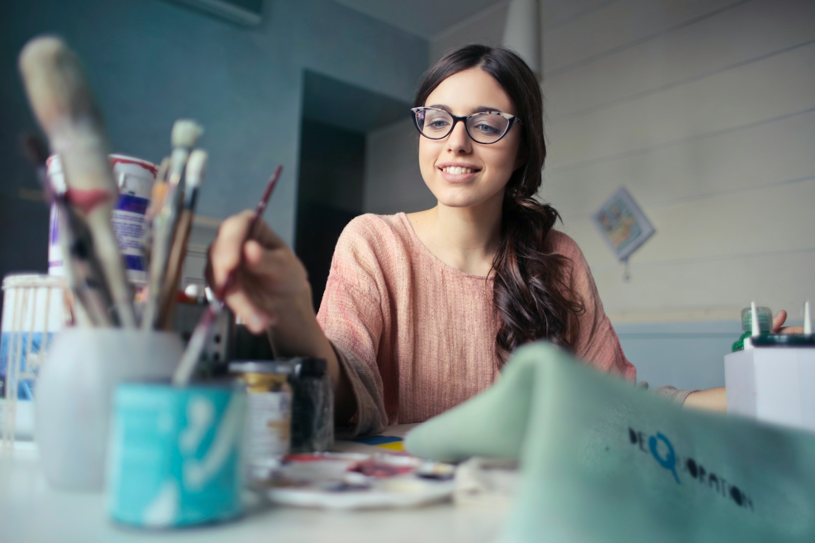 woman holding paint brush